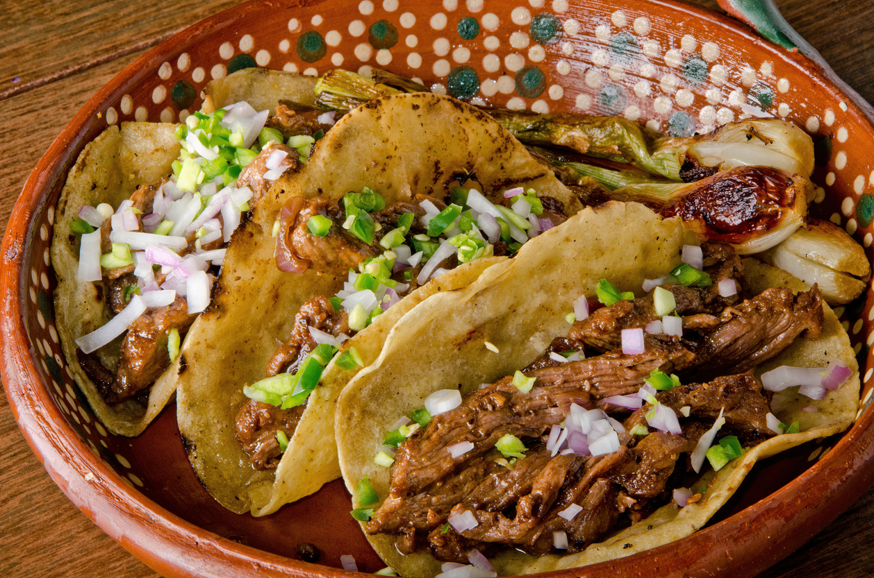 authentic Mexican barbacoa tacos with fresh onion and cilantro