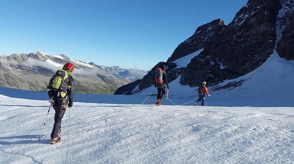 Climbers on a snow covered mountain