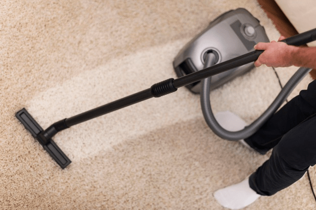 Close up of vacuuming a carpet