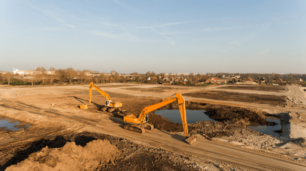 High angle shot of two excavators on a building site