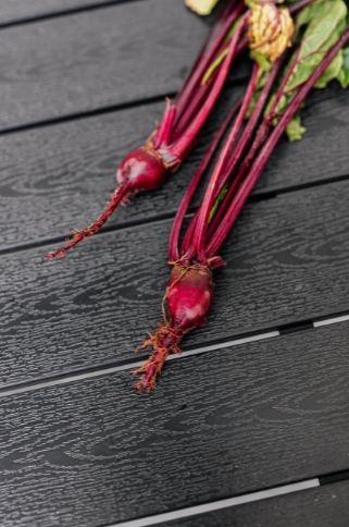 Beetroots placed on a wooden table.