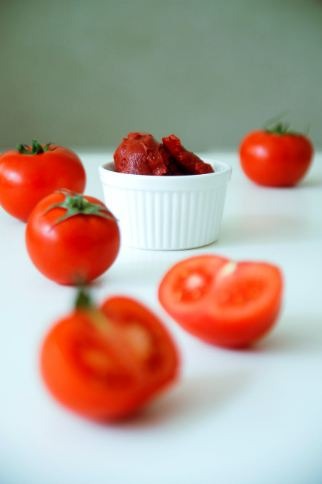 Tomato paste in a ceramic bowl.