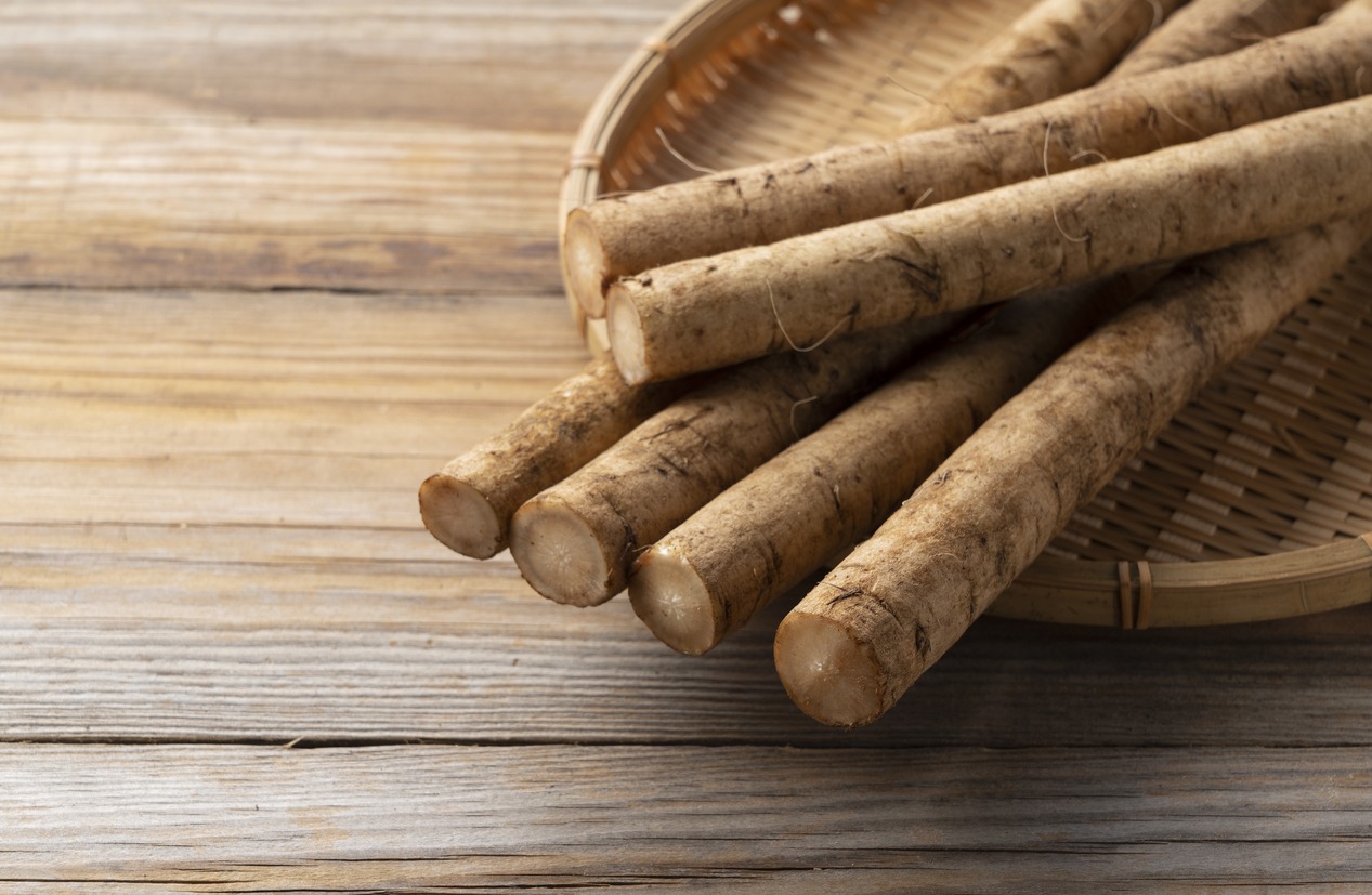 A burdock placed against a background of wooden boards