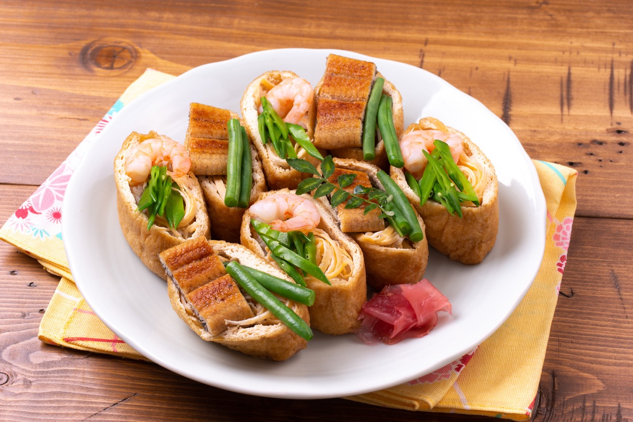 a plate of Inari sushi