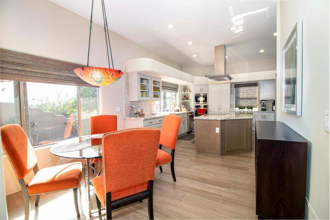 Orange chairs near the table