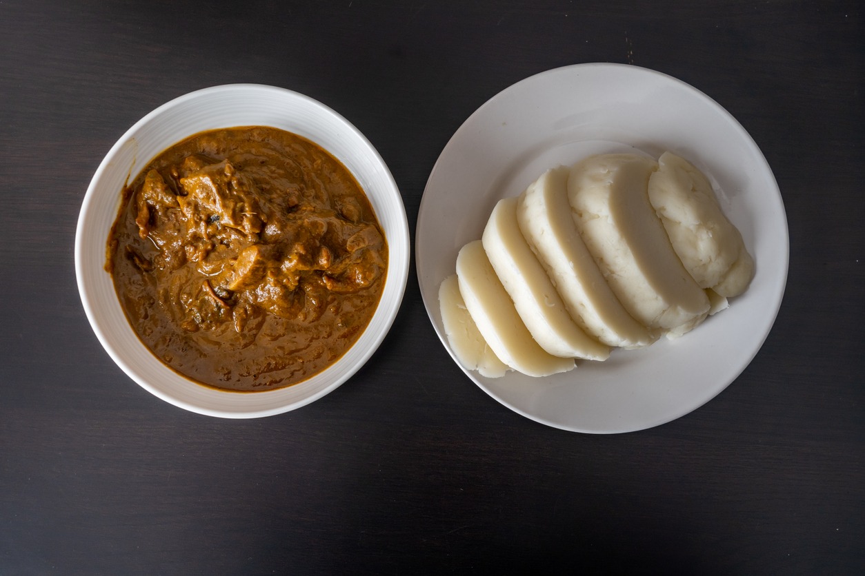 Nigerian pounded yam sliced served with banga Soup